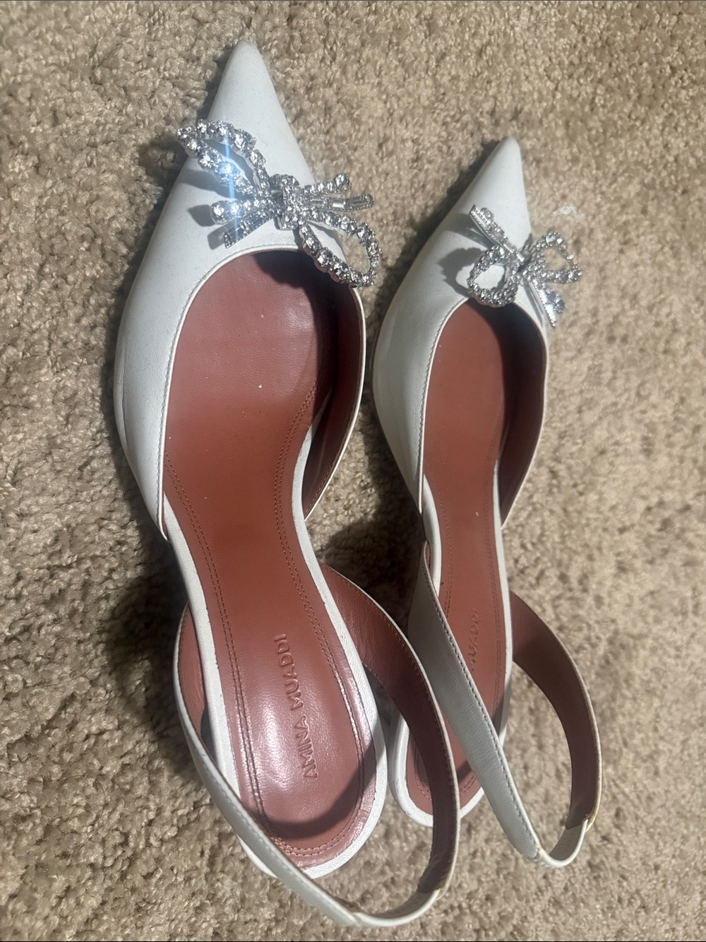 Amina Muaddi White Pointed Slingback Flats with Crystal Bow